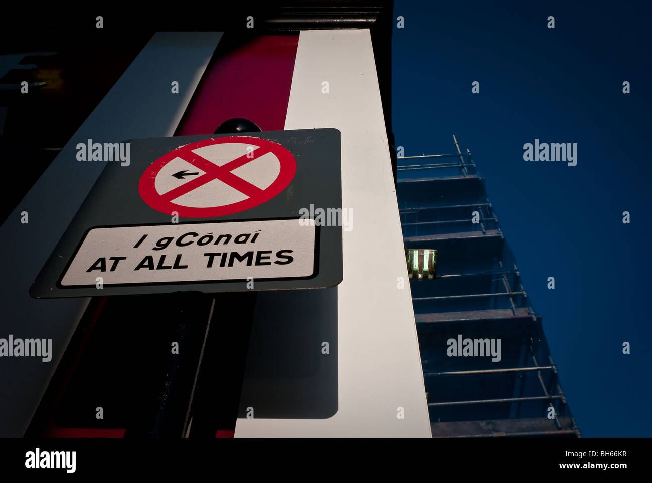 A road sign in Ireland against a dark blue sky Stock Photo - Alamy