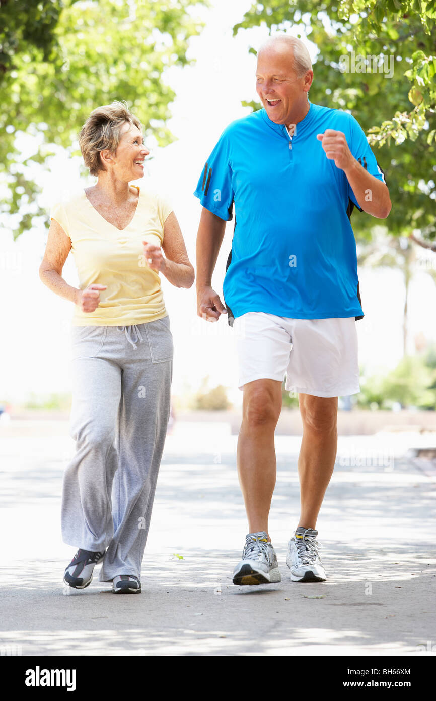 Senior Couple Jogging In Park Stock Photo - Alamy
