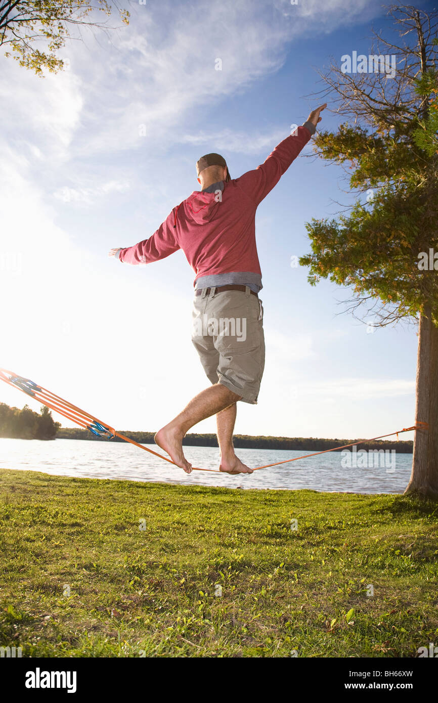 Man on slackline hi-res stock photography and images - Alamy