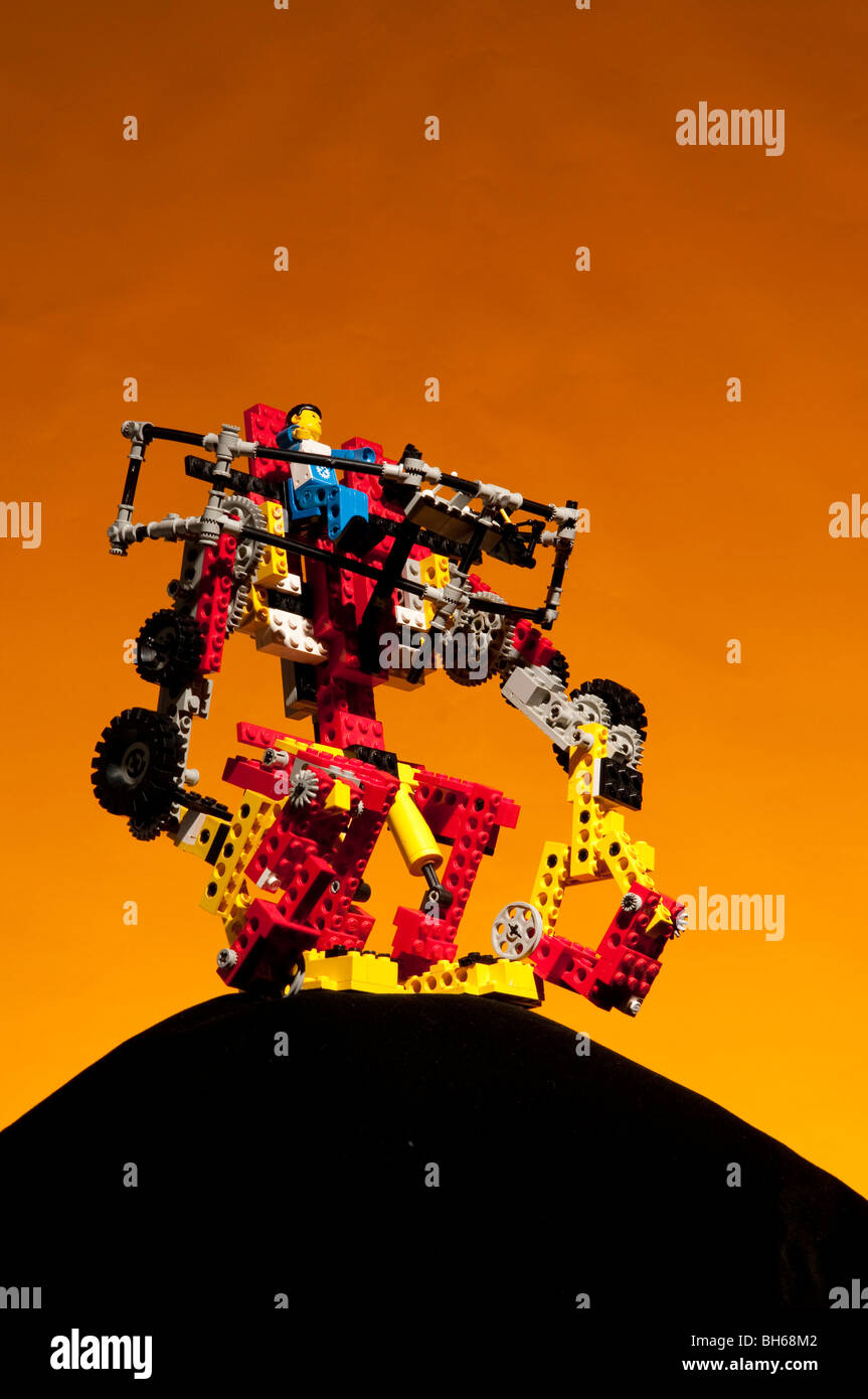 Lego Robot Standing On Mound Of Black Lego Stock Photo