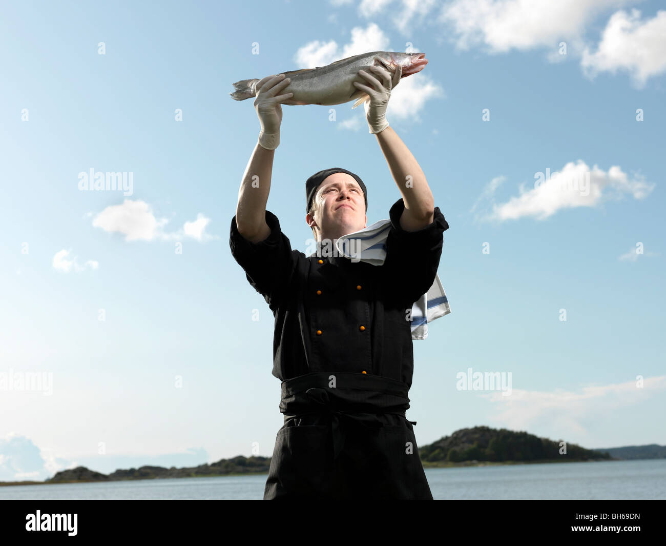 Chef holding fish Stock Photo
