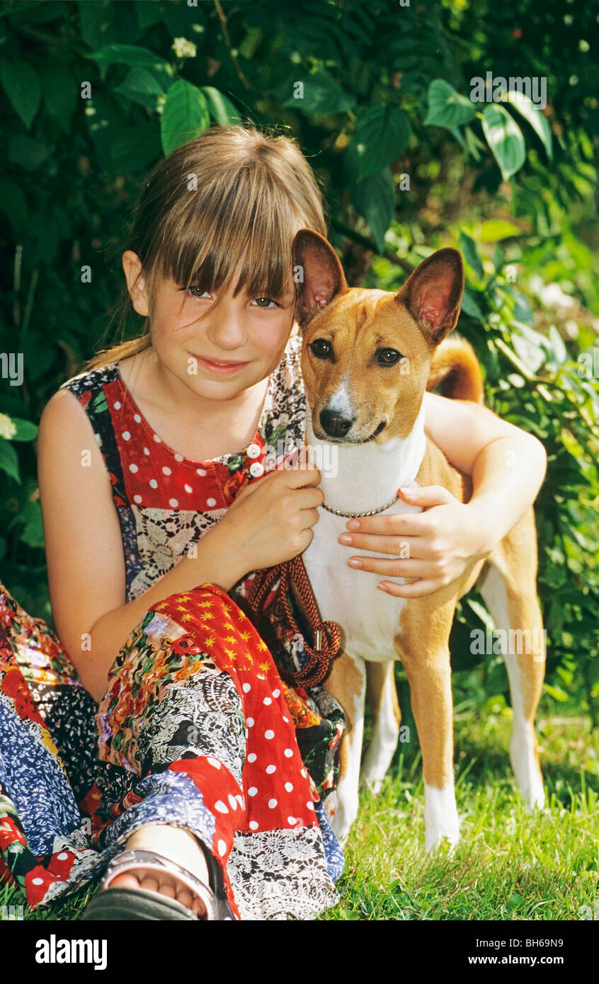 girl hugging a Shiba Inu dog Stock Photo
