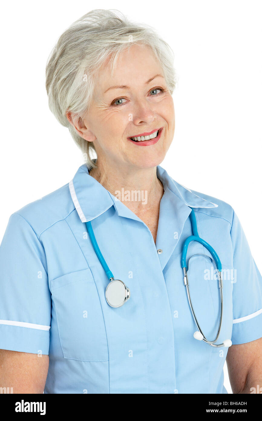 Studio Portrait Of Senior Nurse Stock Photo