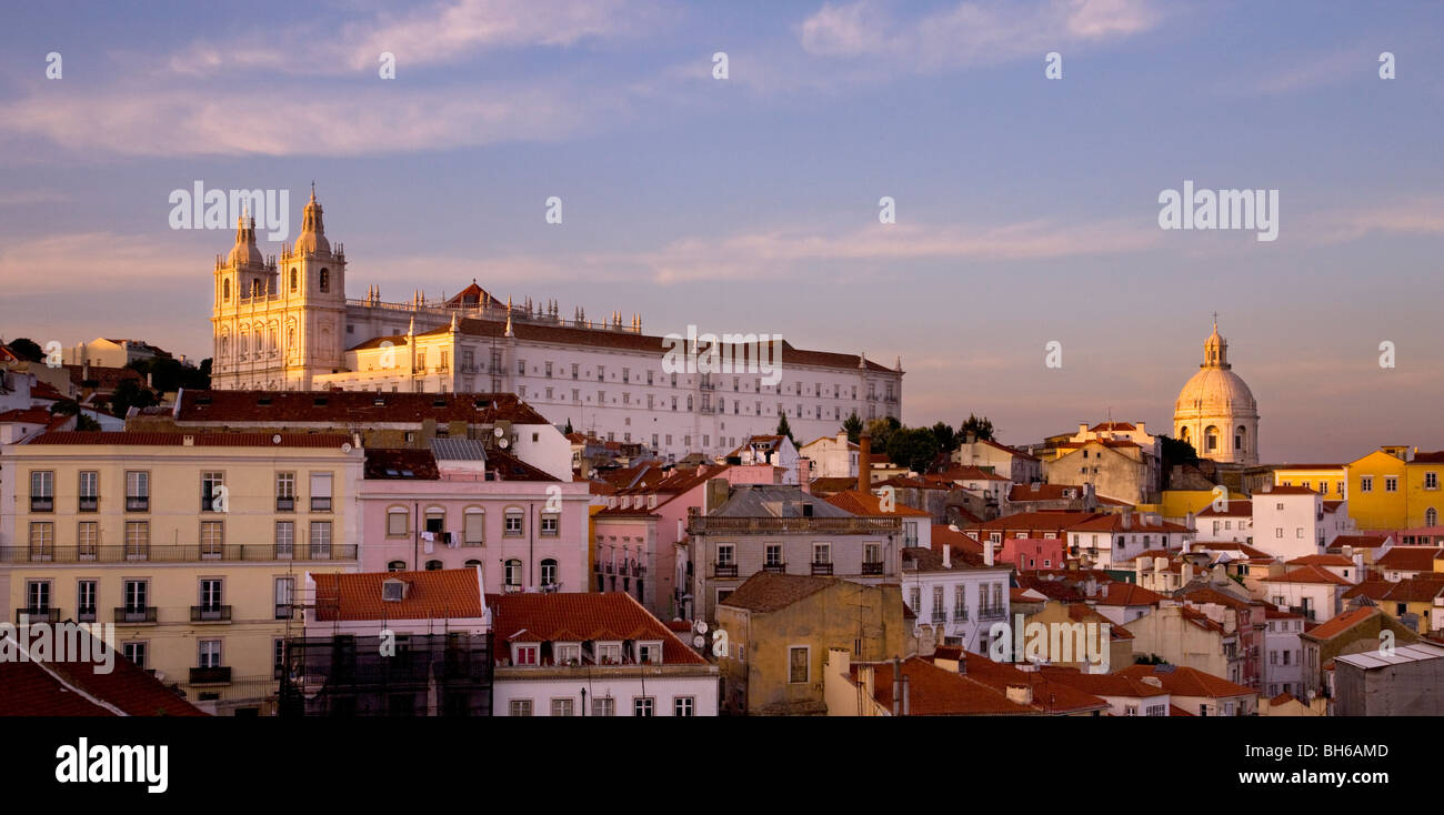 Panoramic late afternoon view over rooftops of Alfama district to church of Aao Viaente de fora, Lisbon, Portugal, Europe Stock Photo