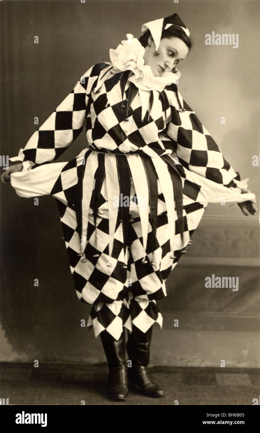 Beautiful Clown Jester in Checkered Costume Stock Photo - Alamy