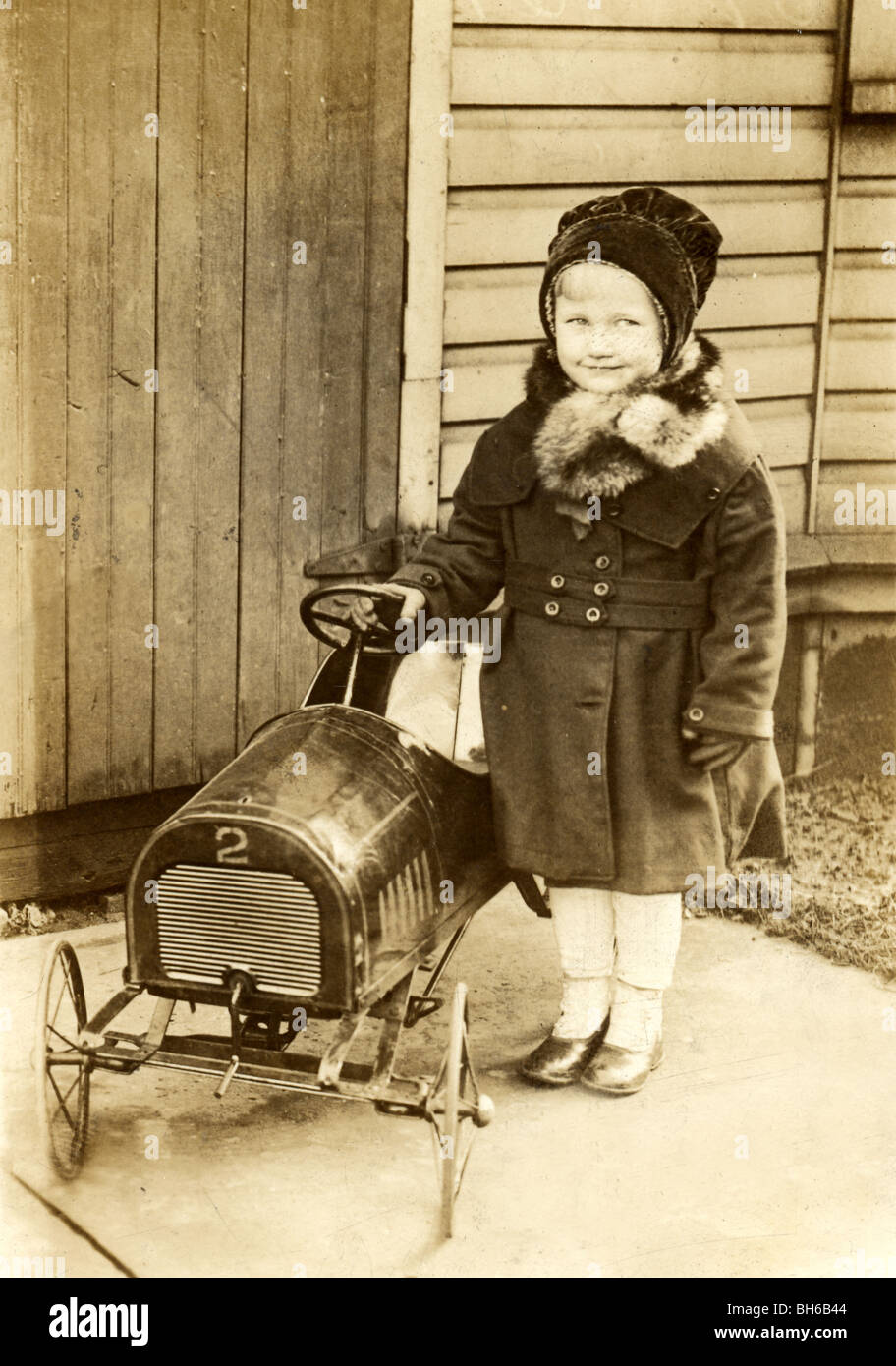 Proud Little Girl with Pedal Car No. 2 Stock Photo
