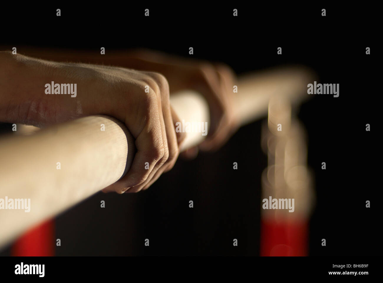 gymnast's hands grabbing a bar Stock Photo