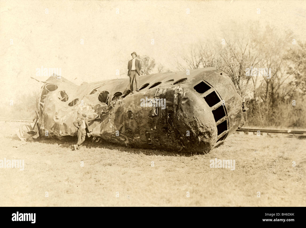 Two Men at Wrecked & Mangled Trolley Car Stock Photo