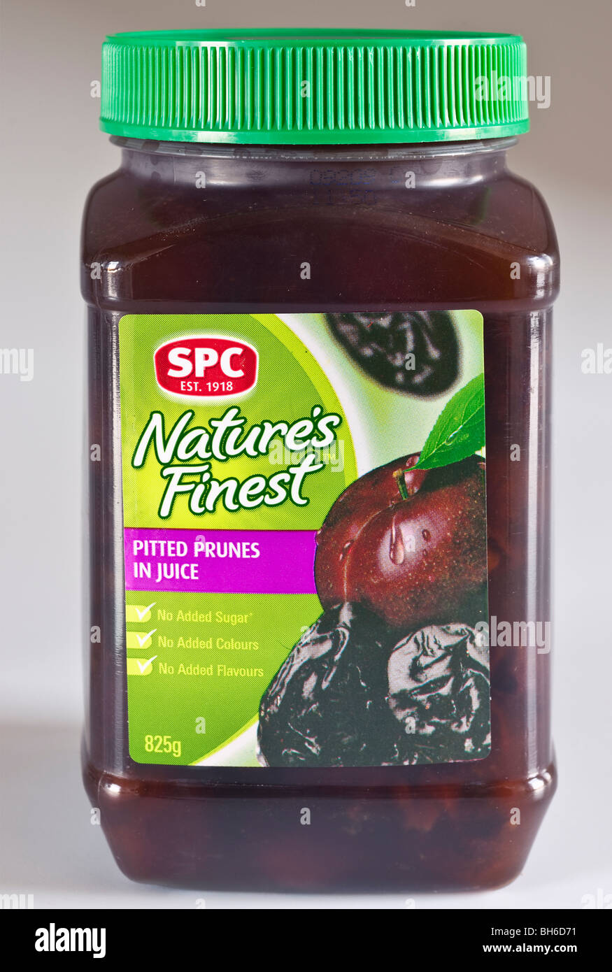 825 gram plastic container of SPC Natures Finest Pitted prunes in juice Stock Photo