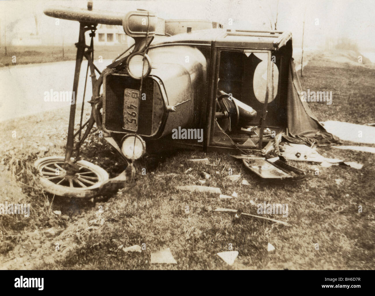 Wrecked Auto Overturned by the Road Stock Photo