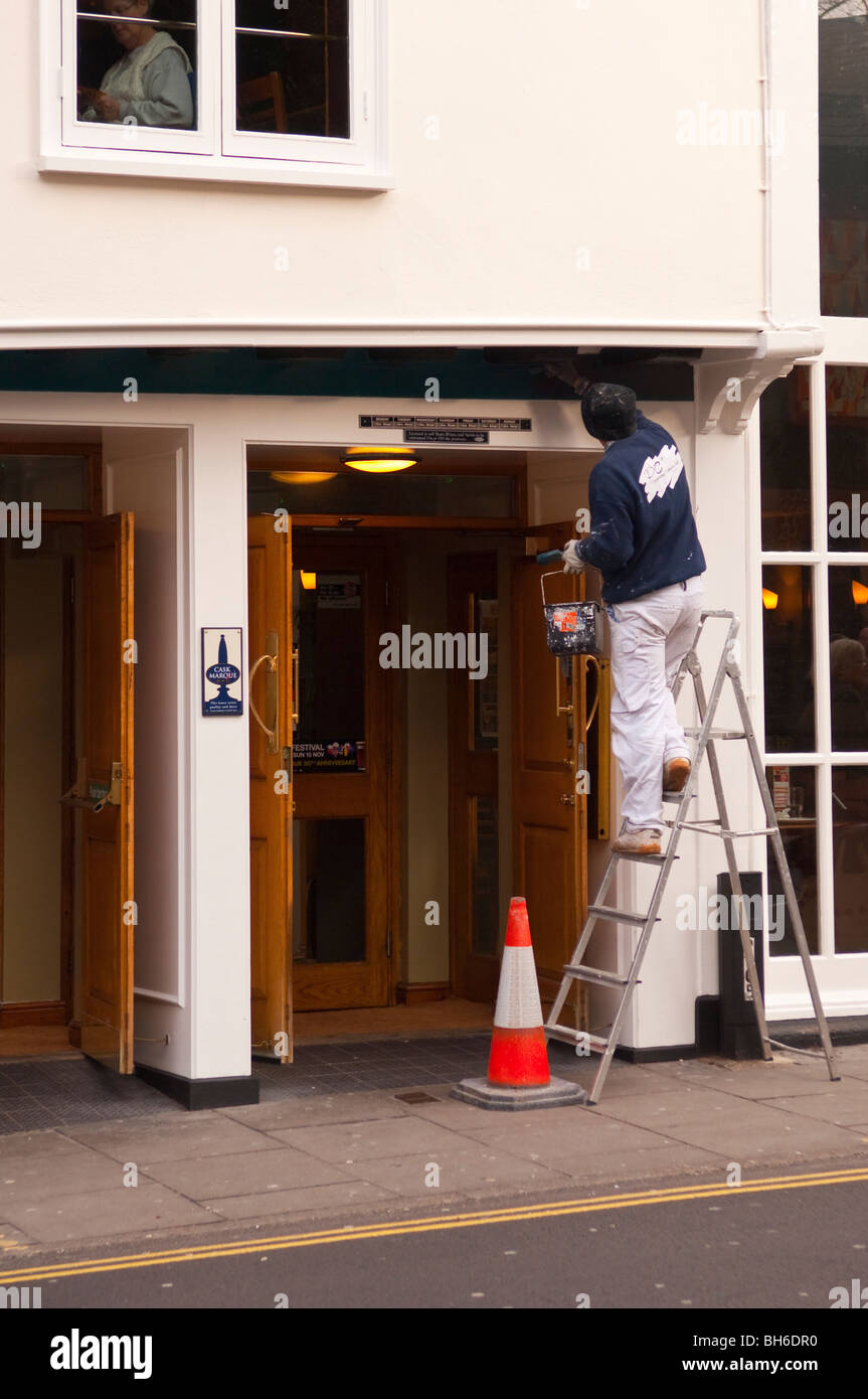 A Painter Decorator At Work In Norwich Norfolk England Stock