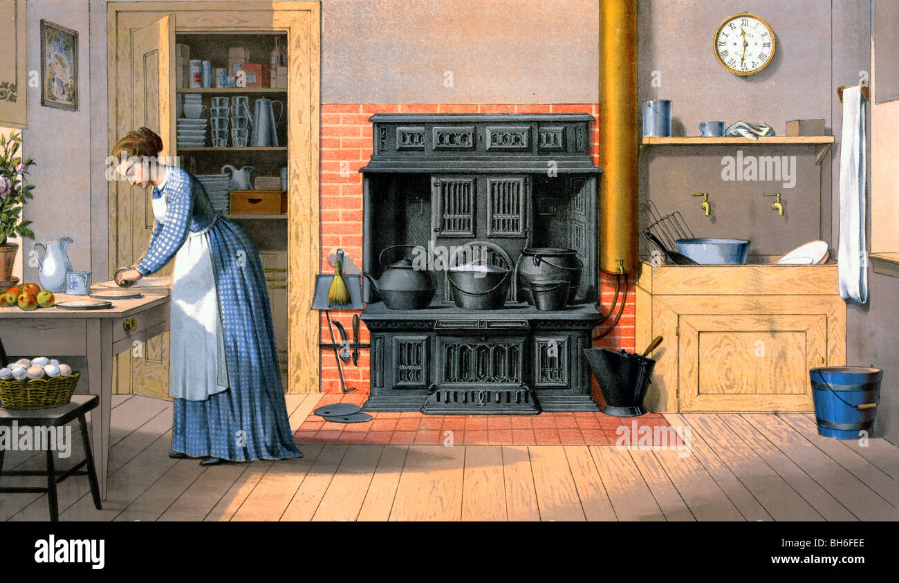 Woman working in an old fashioned kitchen, 1875 Stock Photo