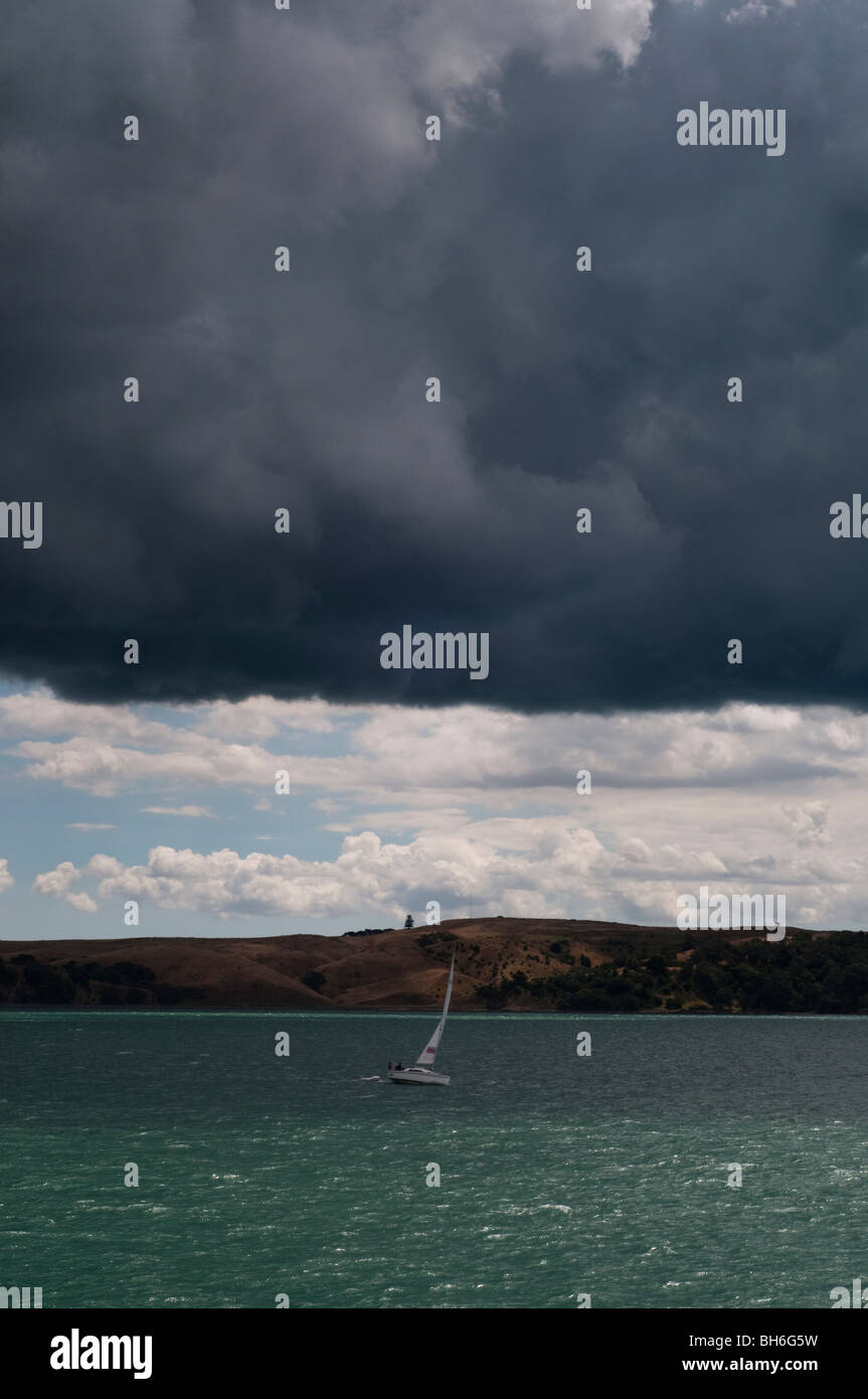 strom front with sailing boat, New Zealand Stock Photo Alamy