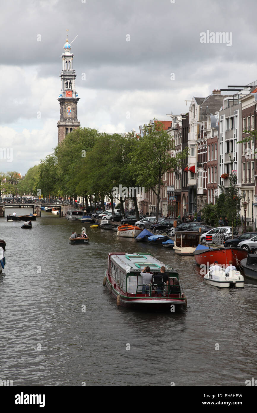 View on the Wester Tower church in Amsterdam along canal Stock Photo