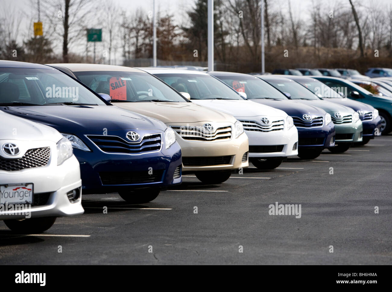 Toyota vehicles on a dealership lot.  Stock Photo