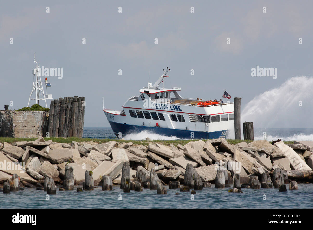 Ferry boat on Lake Huron in Michigan USA ferryboat guiding guide man tourists tourist Great