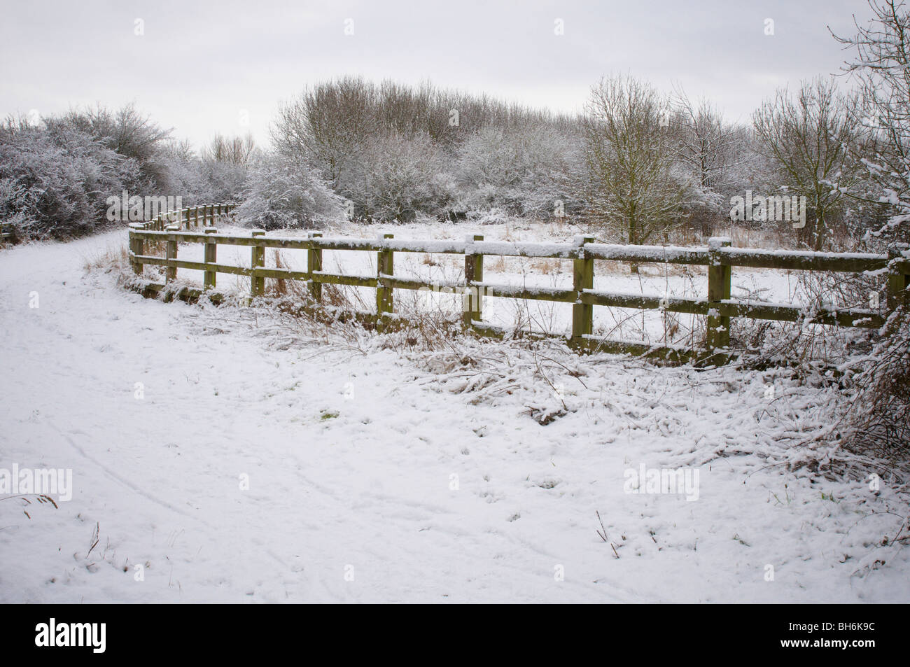 snowy scene winter fences and gate Stock Photo
