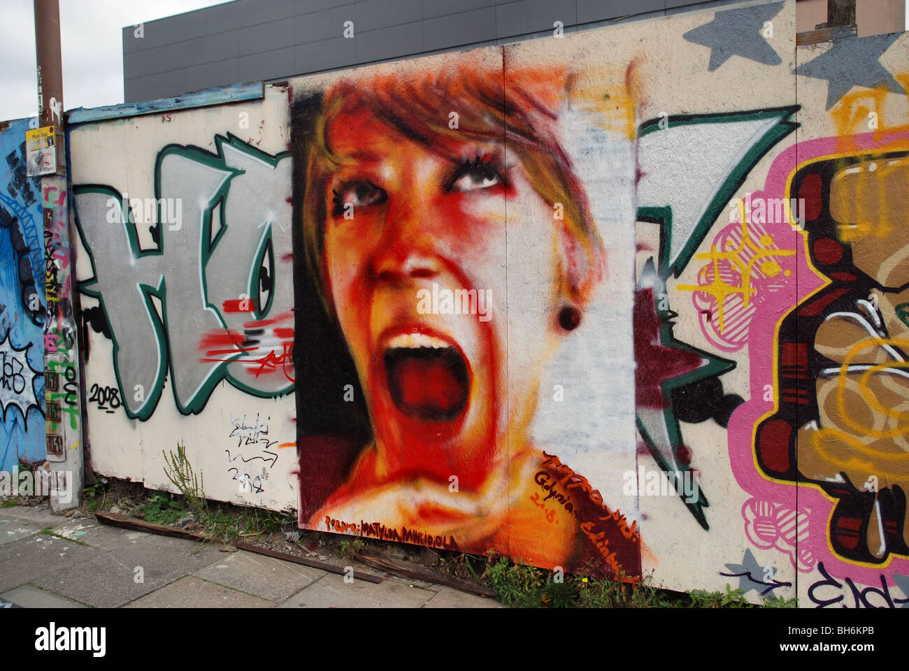 Graffiti painting of a girl looking happy Stock Photo