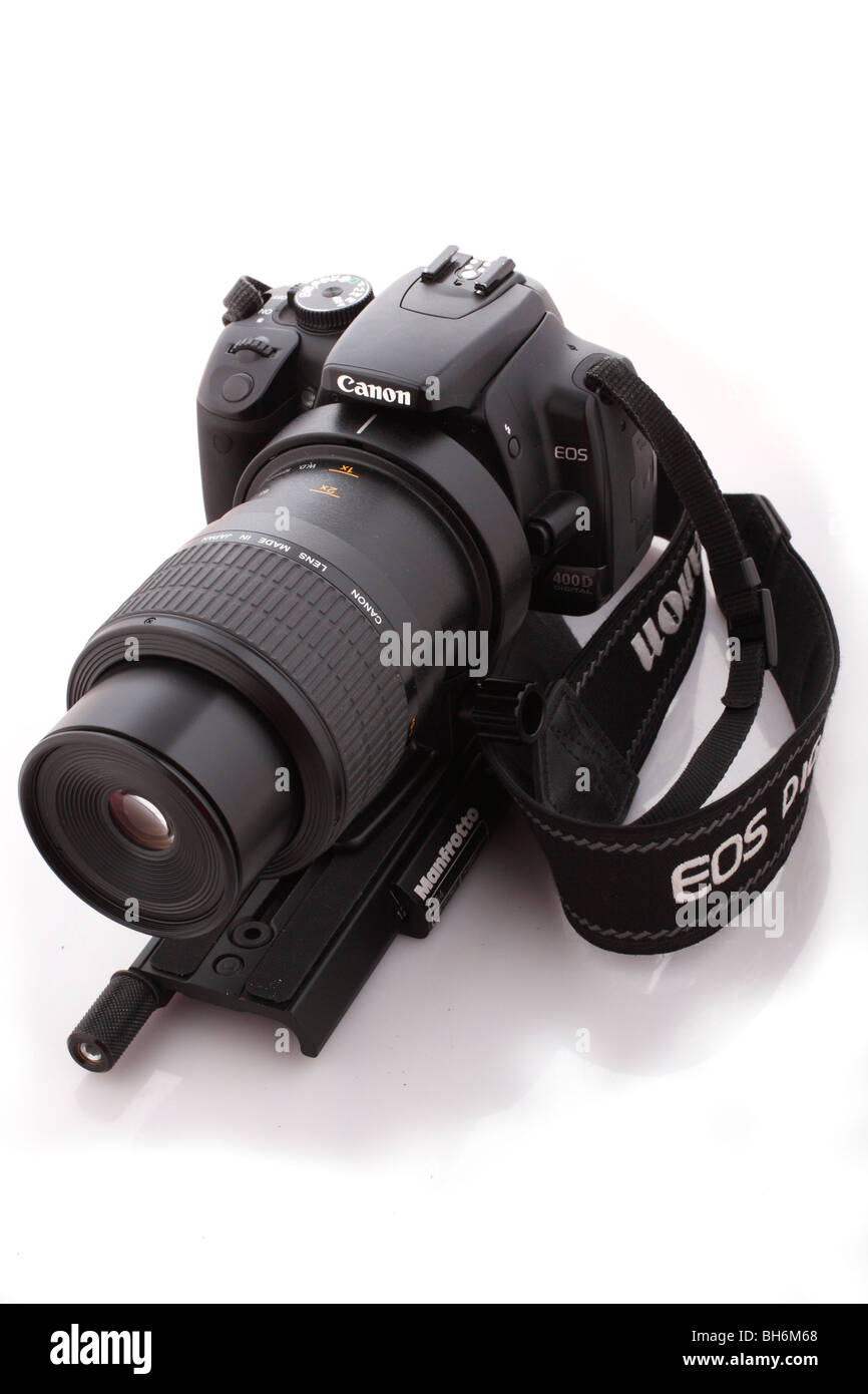 Canon EOS 400D with wide strap and Canon EOS MP-E 65mm f2.8 1-5x macro lens and a Manfrotto focus rail Stock Photo