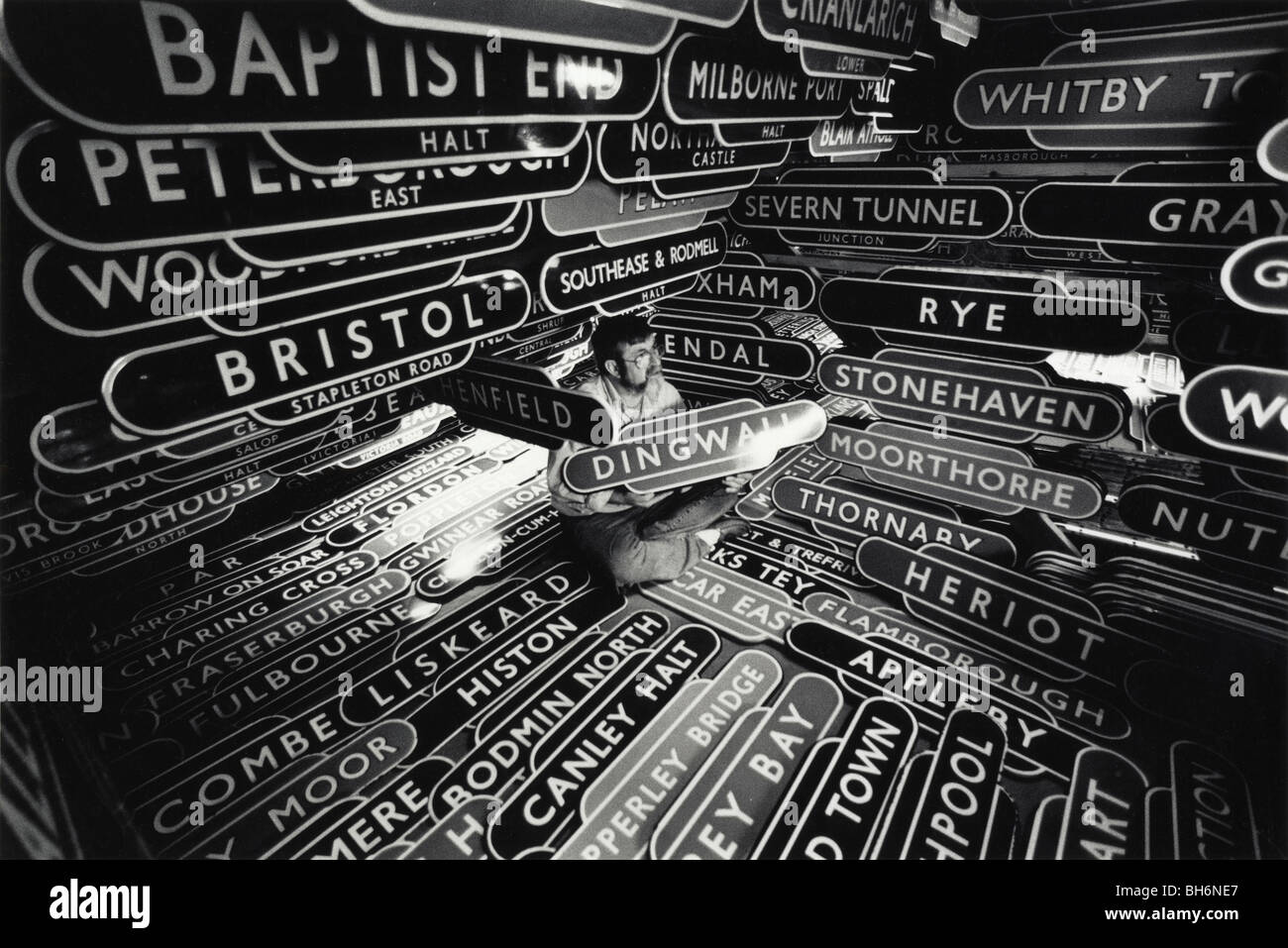 A railway enthusiast and collector with some of the 2,000 totems or station names he has amassed. Stock Photo