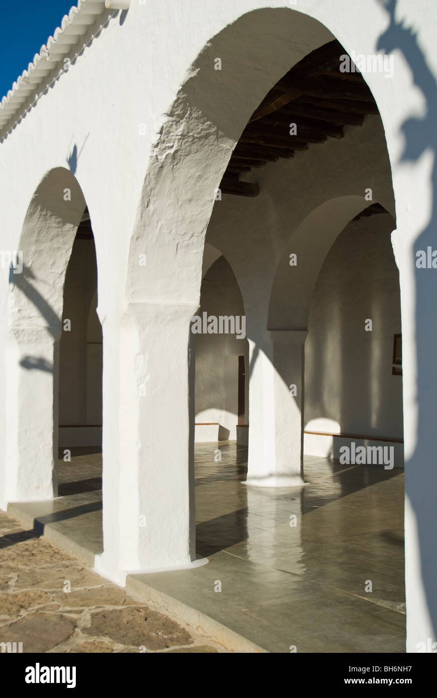 Detail view of arcade and courtyard of the Sant Carles de Peralta church, Ibiza, Spain Stock Photo