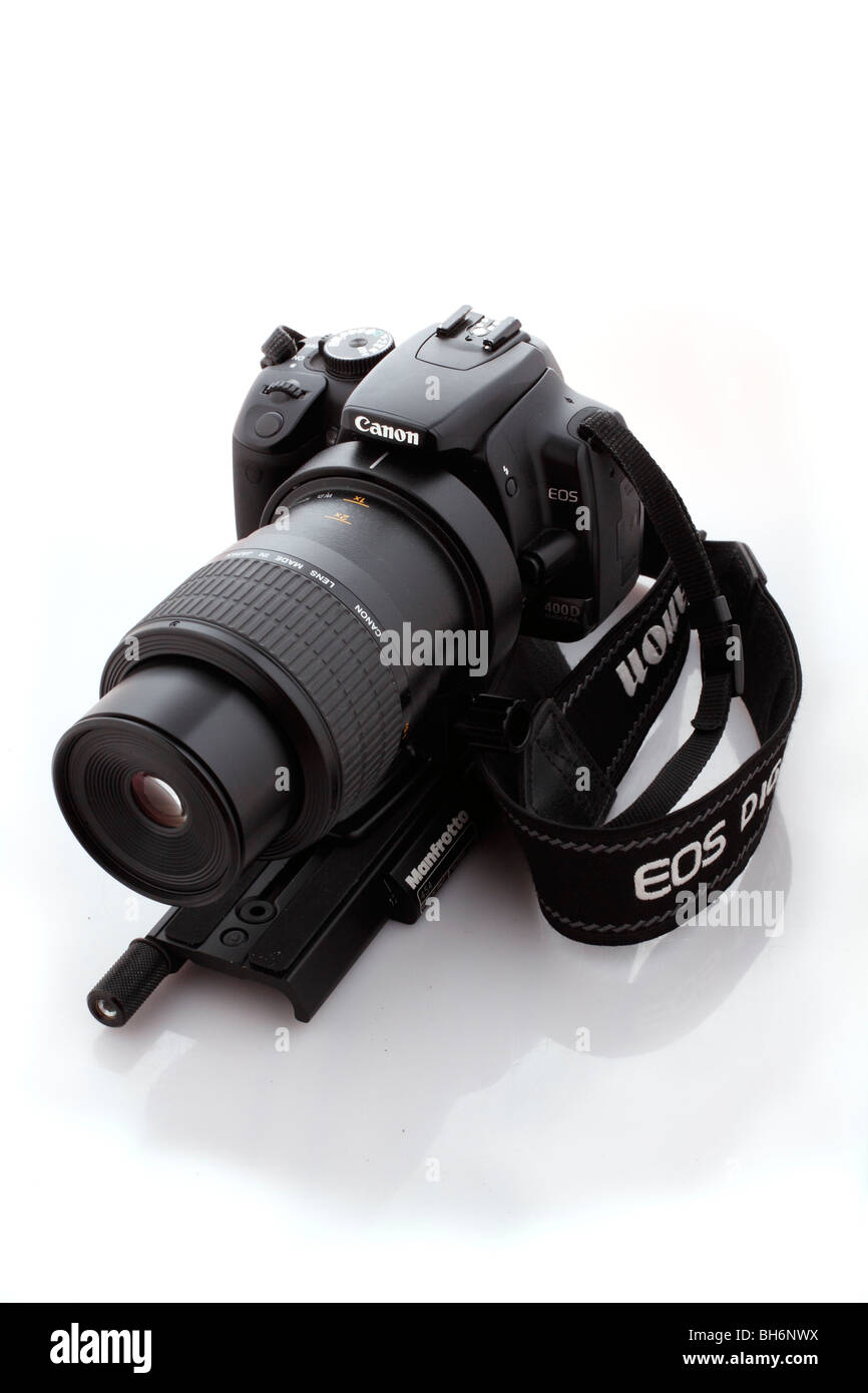 Canon EOS 400D with wide strap and Canon EOS MP-E 65mm f2.8 1-5x macro lens and a Manfrotto focus rail Stock Photo