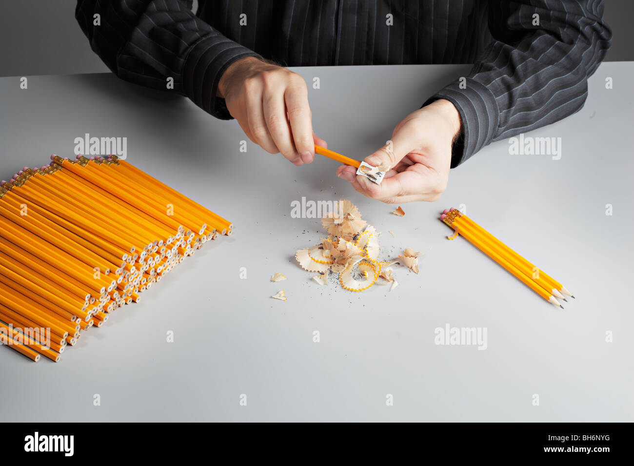 A man sharpening a heap of pencils Stock Photo Alamy