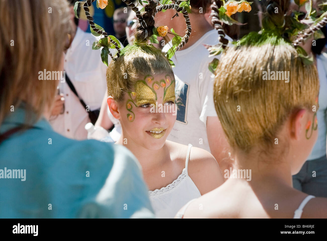 Twin girls with faces painted at the Just for laughs Festival's street