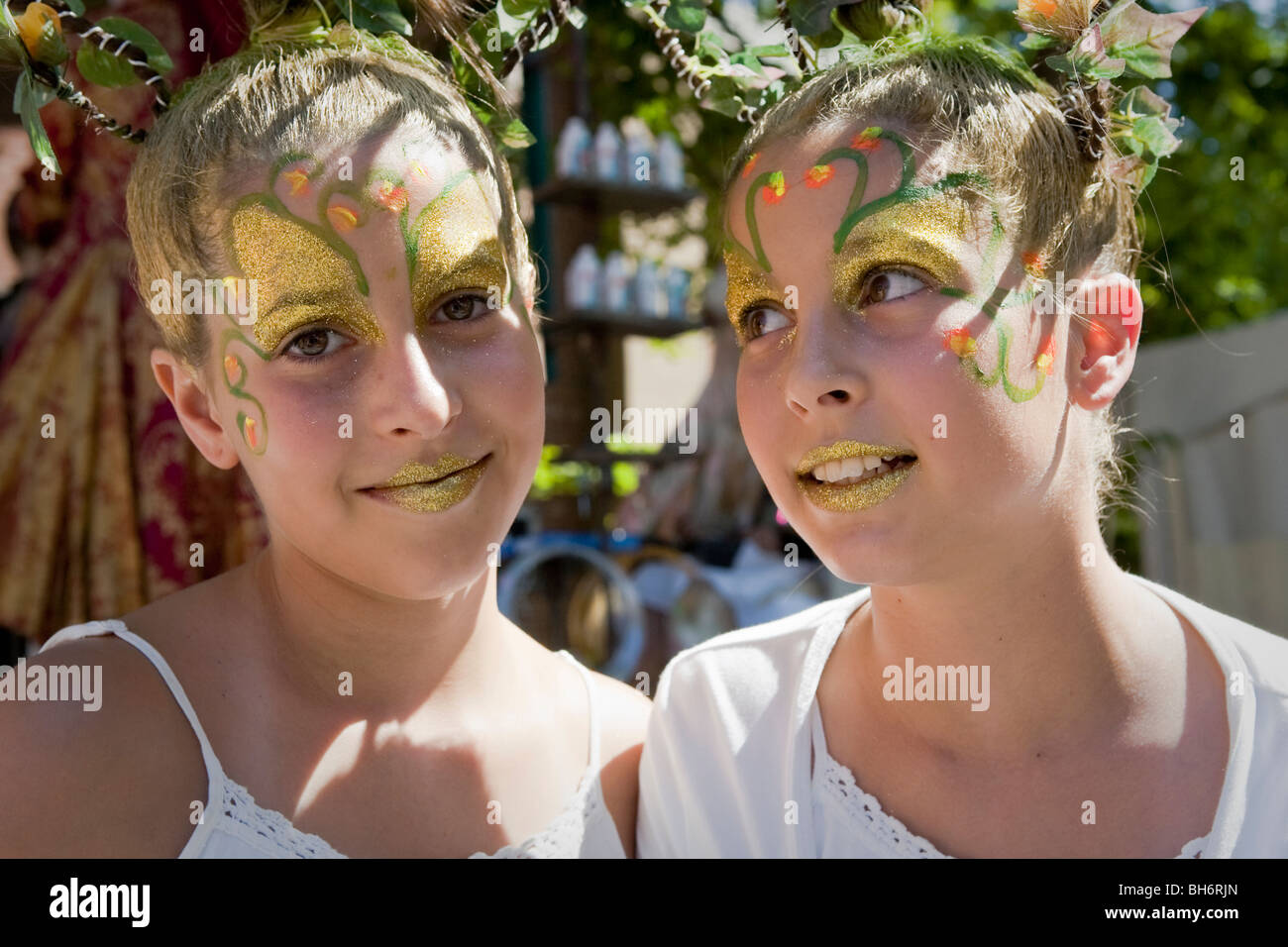 Twin girls with faces painted at the Just for laughs Festival's street
