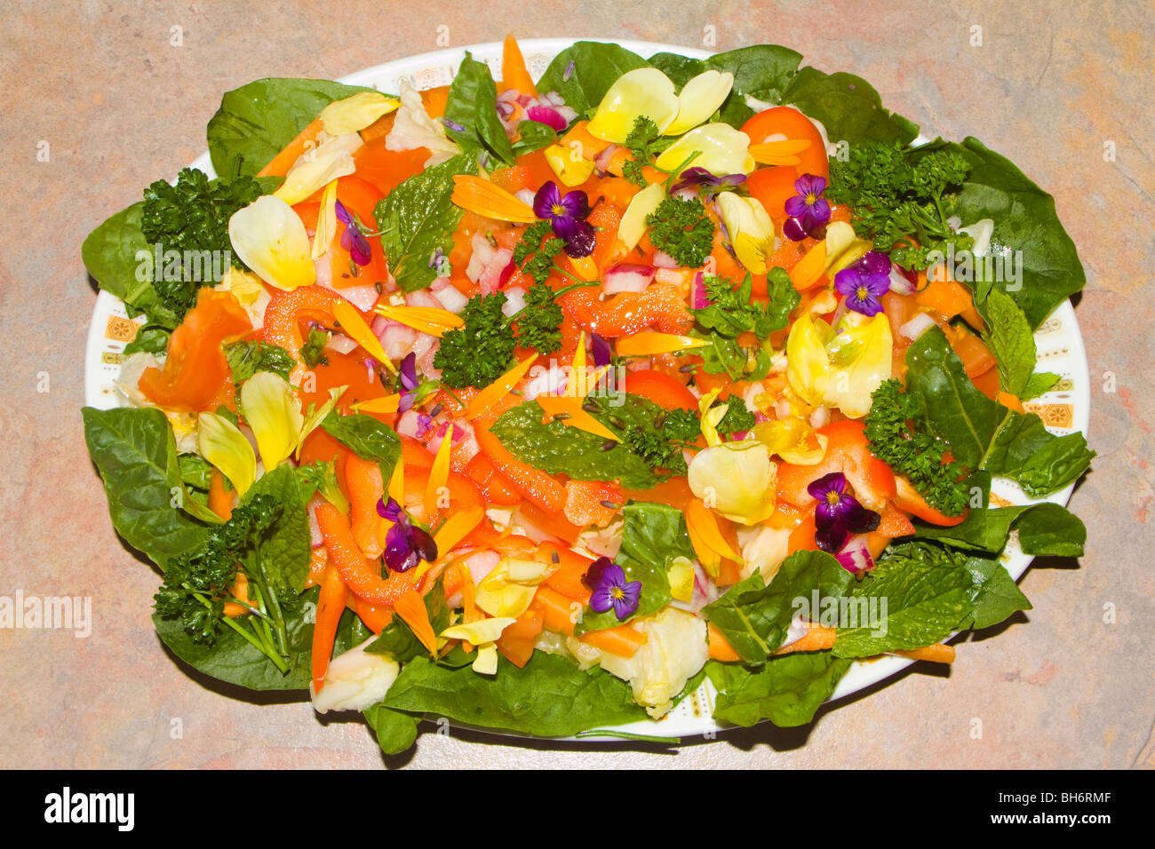 Edible flowers in a salad Stock Photo Alamy