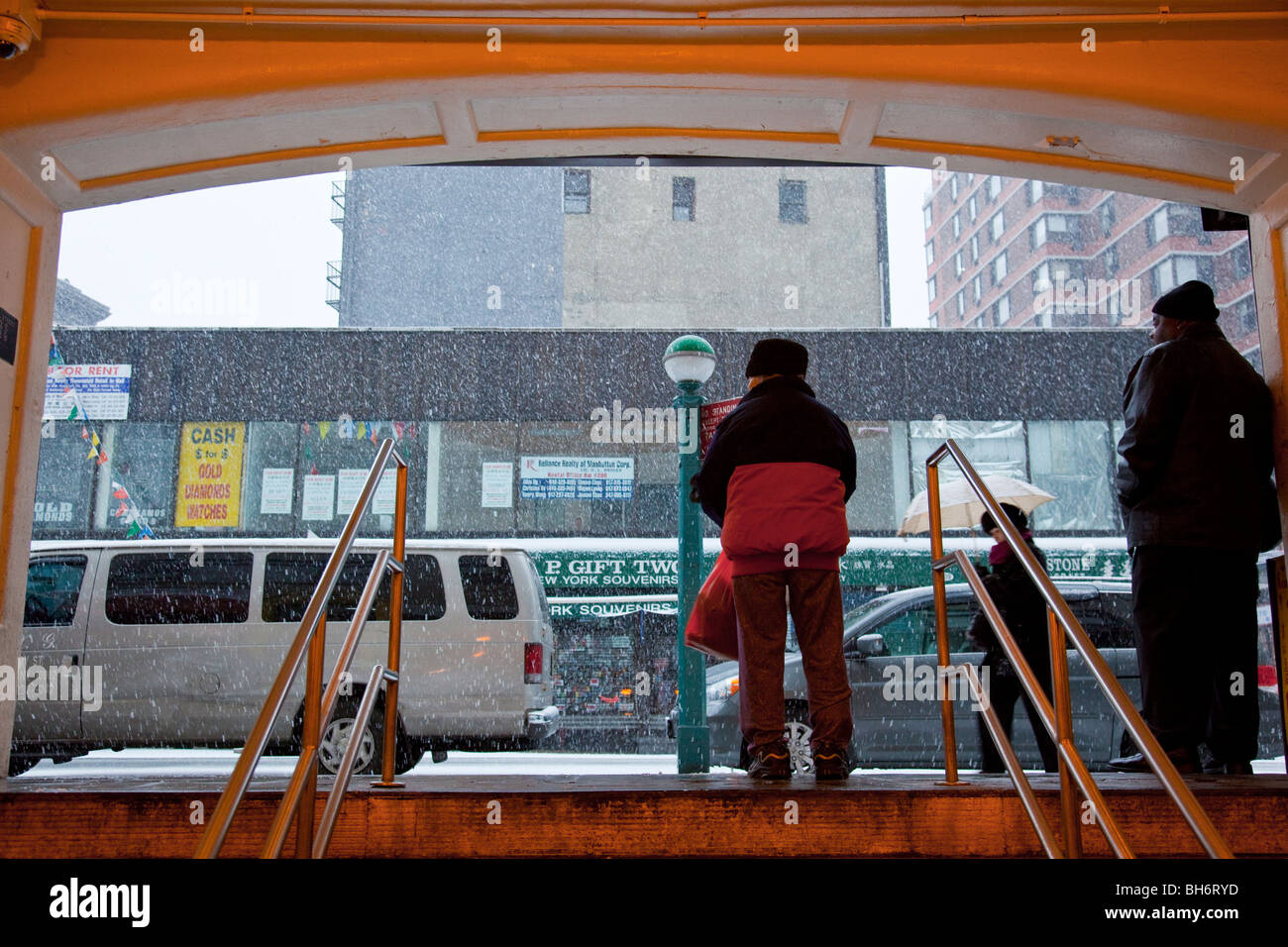 Subway exit during a snowstorm in Manhattan, New York City Stock Photo
