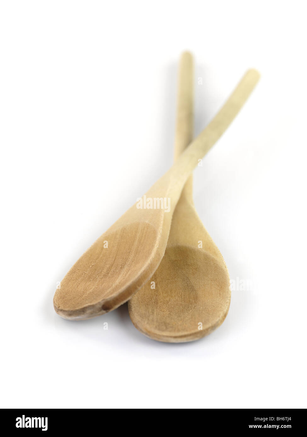 Wooden utensils isolated against a white background Stock Photo - Alamy