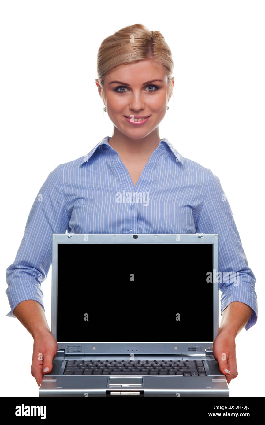Woman holding a laptop with blank screen, clipping path provided for the screen so you can drop in your own message or image Stock Photo