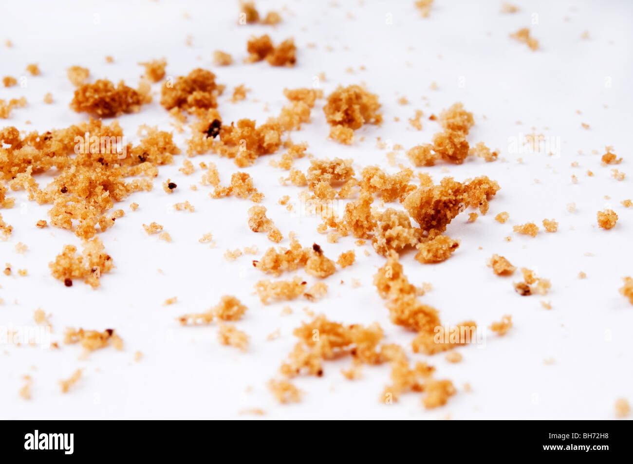 biscuit crumbs on a white table Stock Photo Alamy