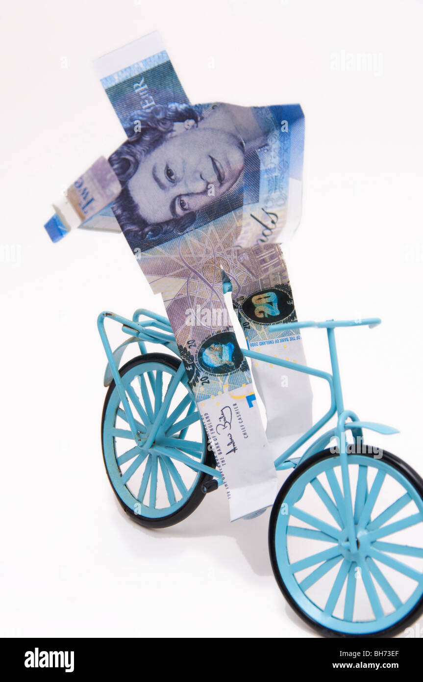 Financial concept British pound riding bike happy currency strong Stock Photo