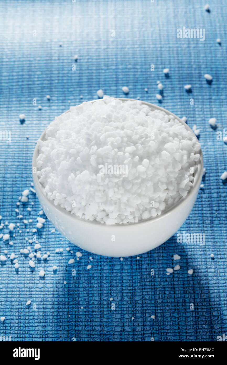 Coarse grained salt used in pepper mills and grinders in a small bowl ...