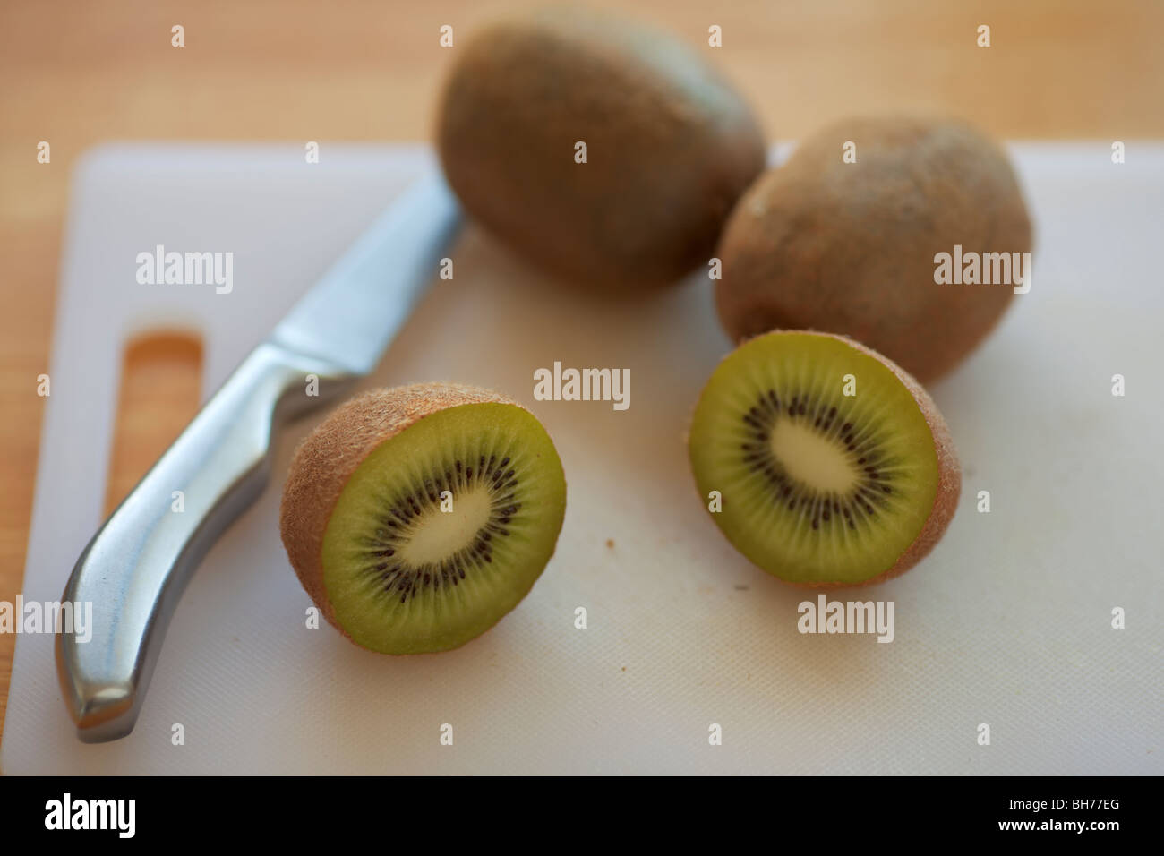 Preparing a few Kiwifruit. Stock Photo