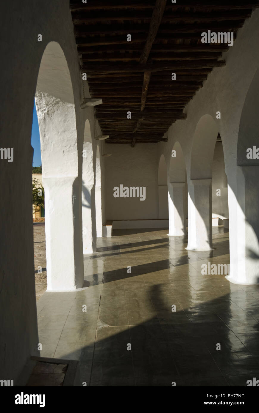 Detail view of arcade and courtyard of the Sant Carles de Peralta church, Ibiza, Spain Stock Photo