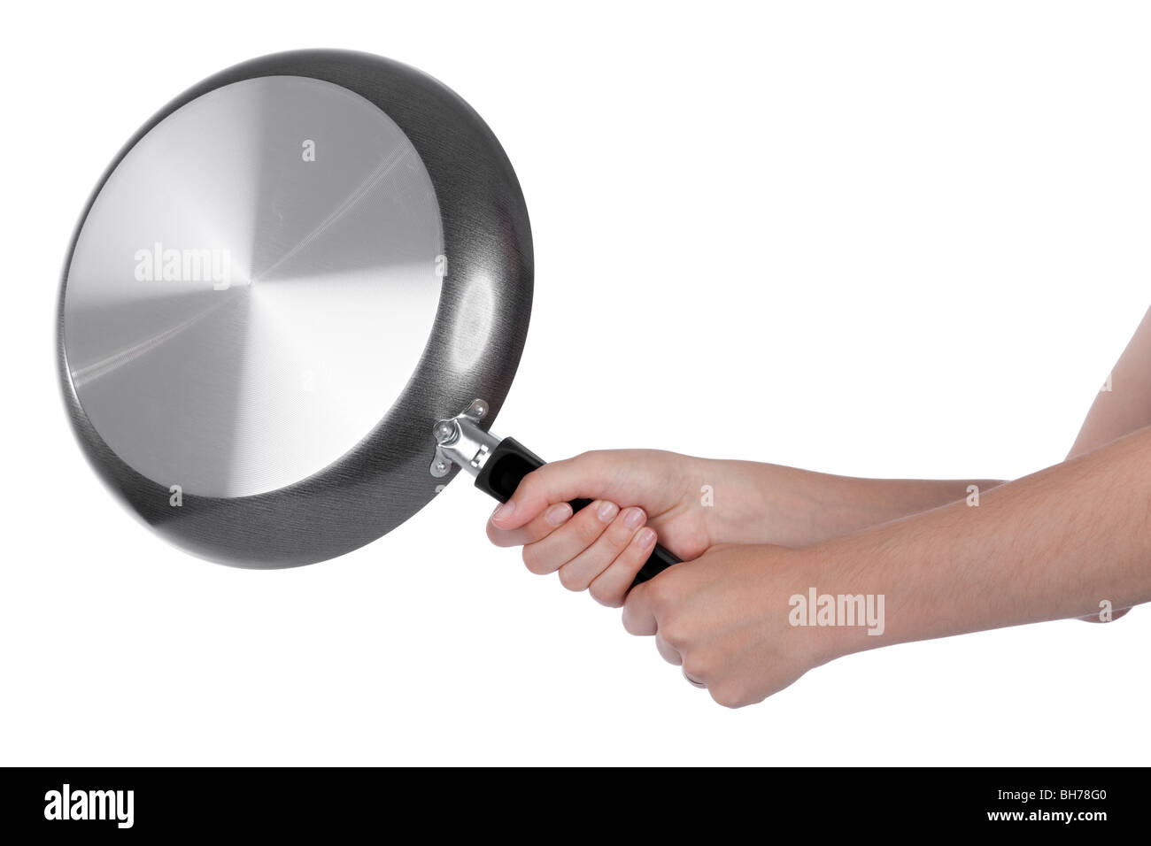 Woman beating with a frying pan isolated on white Stock Photo