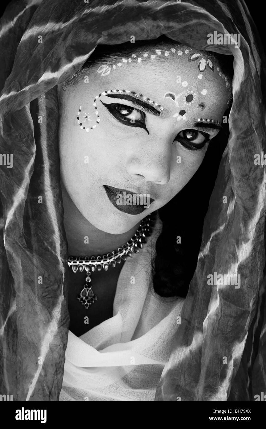 Indian girl, face painted as the Hindu goddess Sita. India. Monochrome Stock Photo