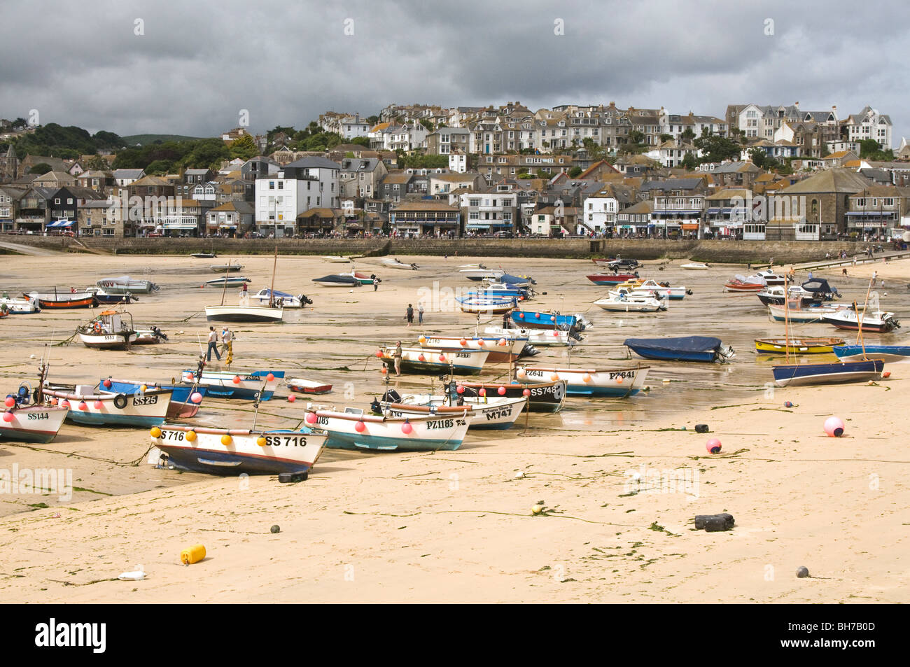St Ives beach in Cornwall at low tide showing all the boats left on the sand Stock Photo