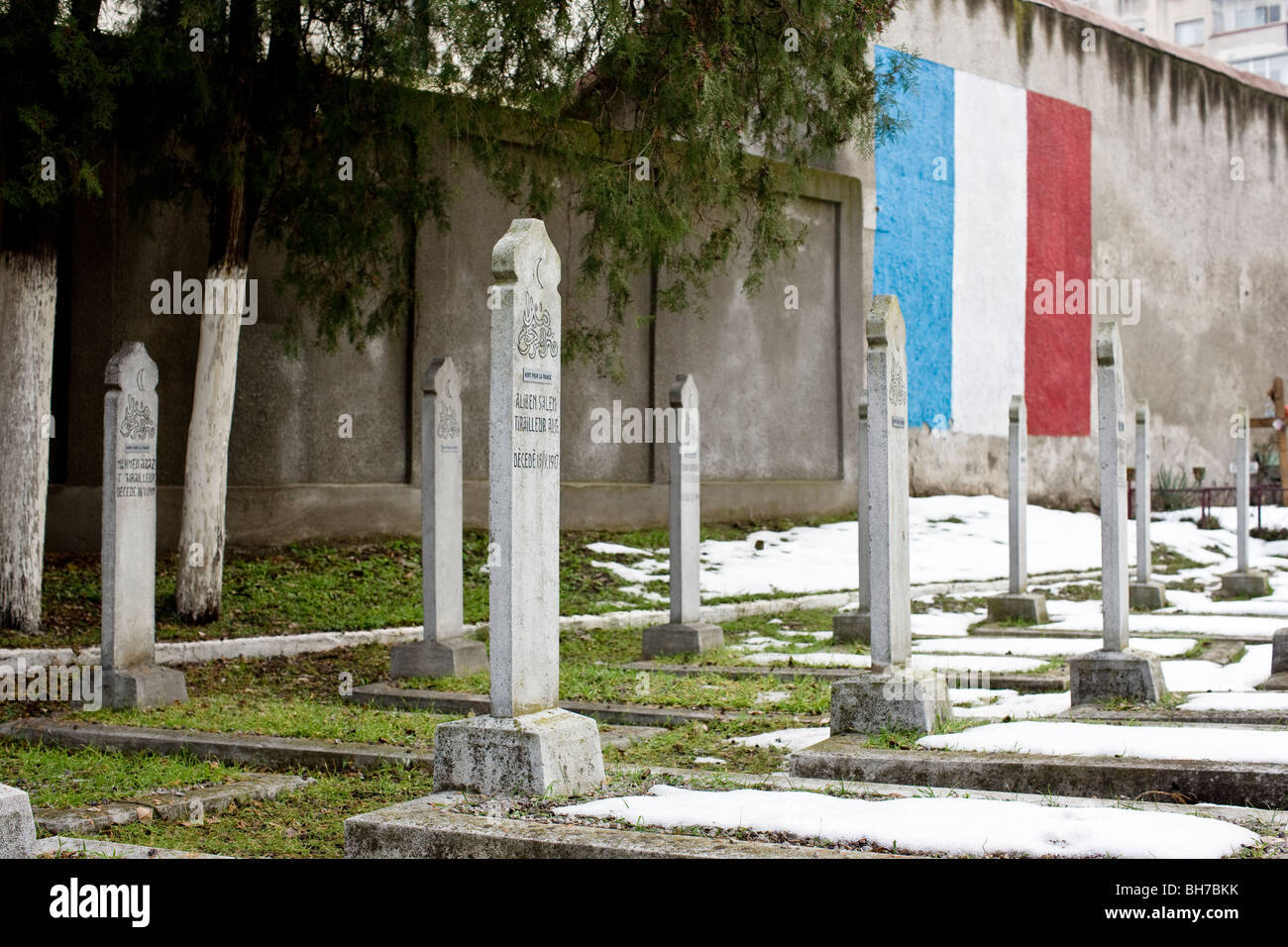WWI french algerian war graves with french flag in the background. Bellu Cemetery Bucharest Romania Stock Photo