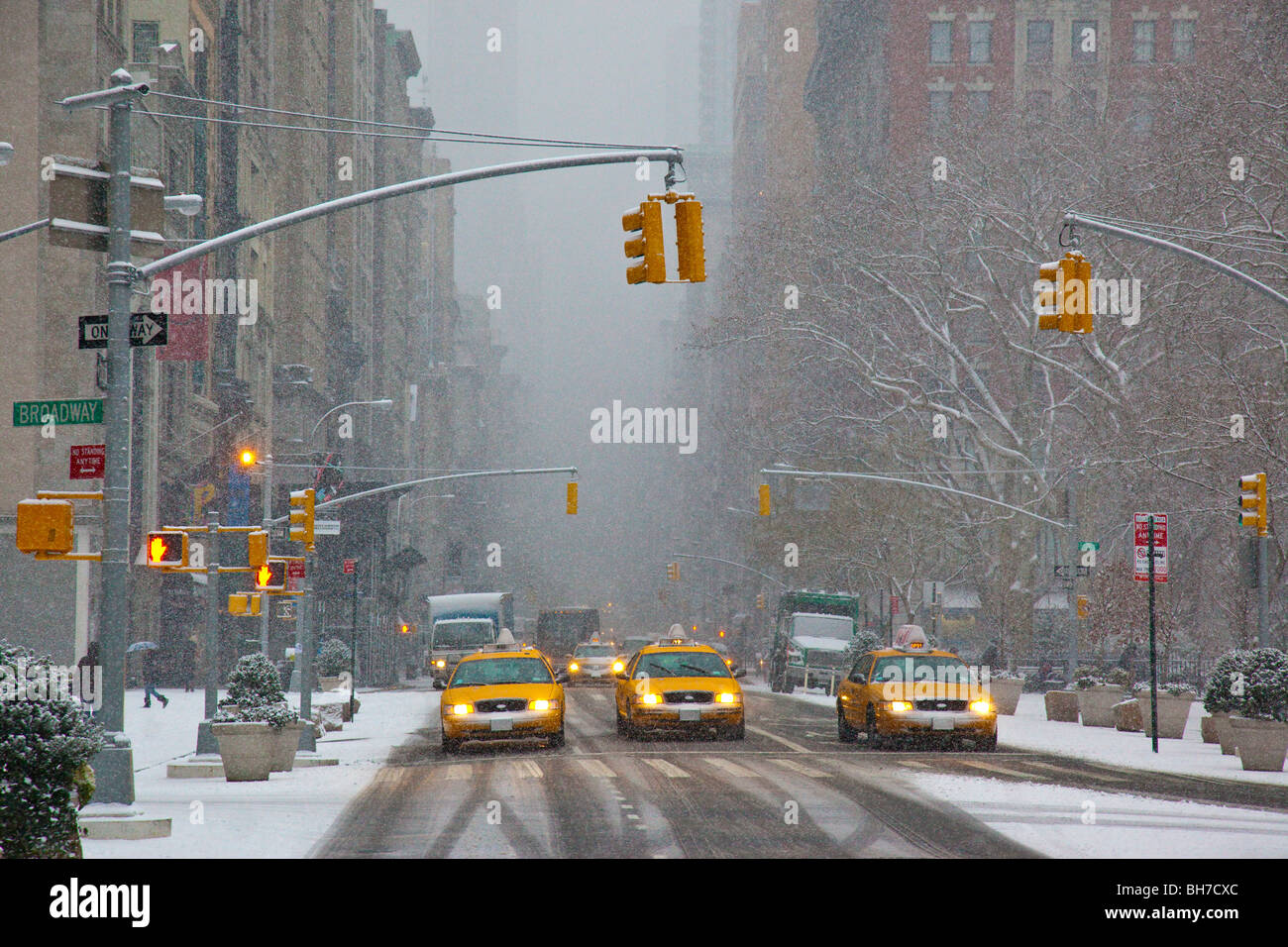 Taxis in Manhattan during a snowstorm, New York City Stock Photo