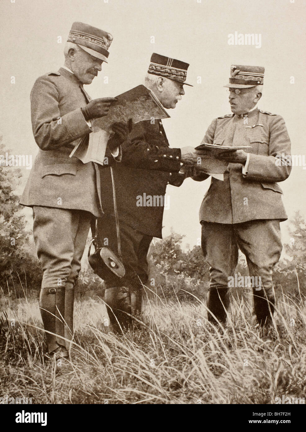 Italian General Porro, French General Joffre and Italian General Cadorna examining maps on the Italian Front in 1915. Stock Photo