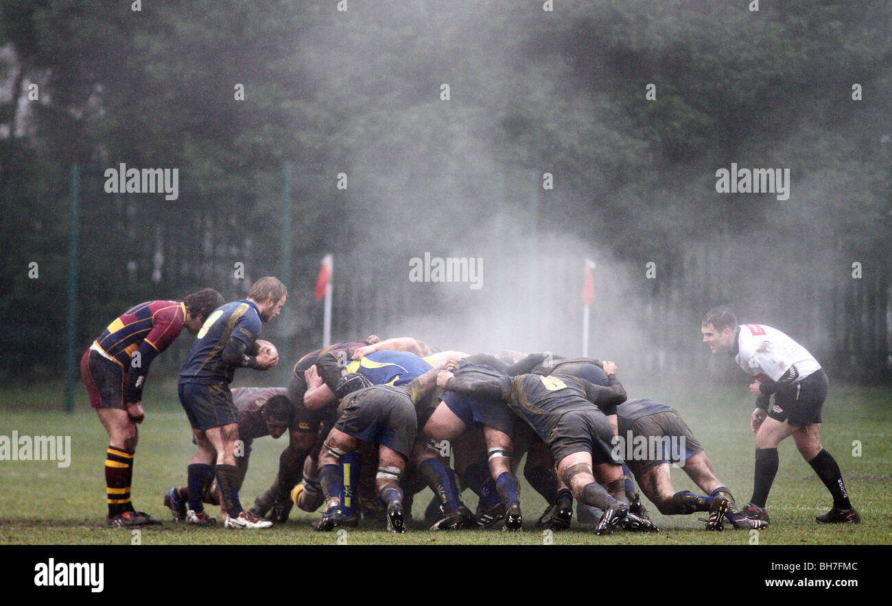 Steam rises from the heat of rugby players during a scrum in cold weather at UWIC, Cardiff. Stock Photo