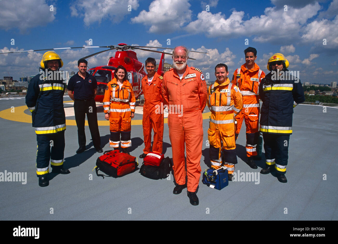 Personnel and crew of the HEMS Air Ambulance stand on the roof of the helipad of the Royal London Whitechapel Hospital l Stock Photo