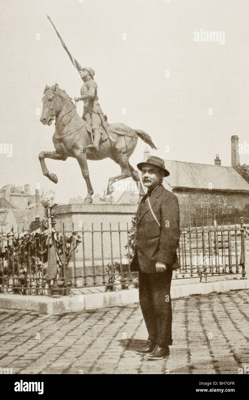 English author Rudyard Kipling standing in front of statue of Joan of Arc in Reims, France, during First World War. Stock Photo