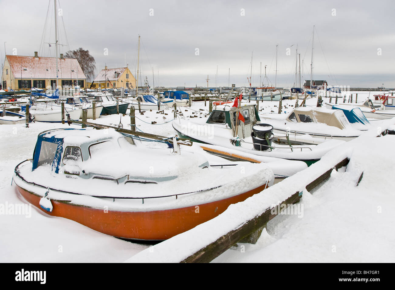 Dragor harbour frozen and covered in snow Stock Photo