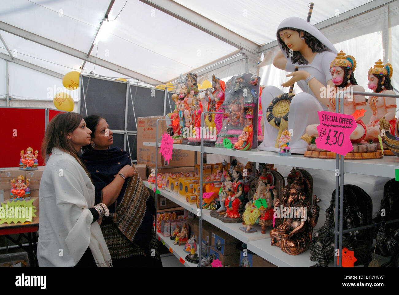 UK. Indian ladies shopping at the Shri Swaminarayan Mandir Hindu temple