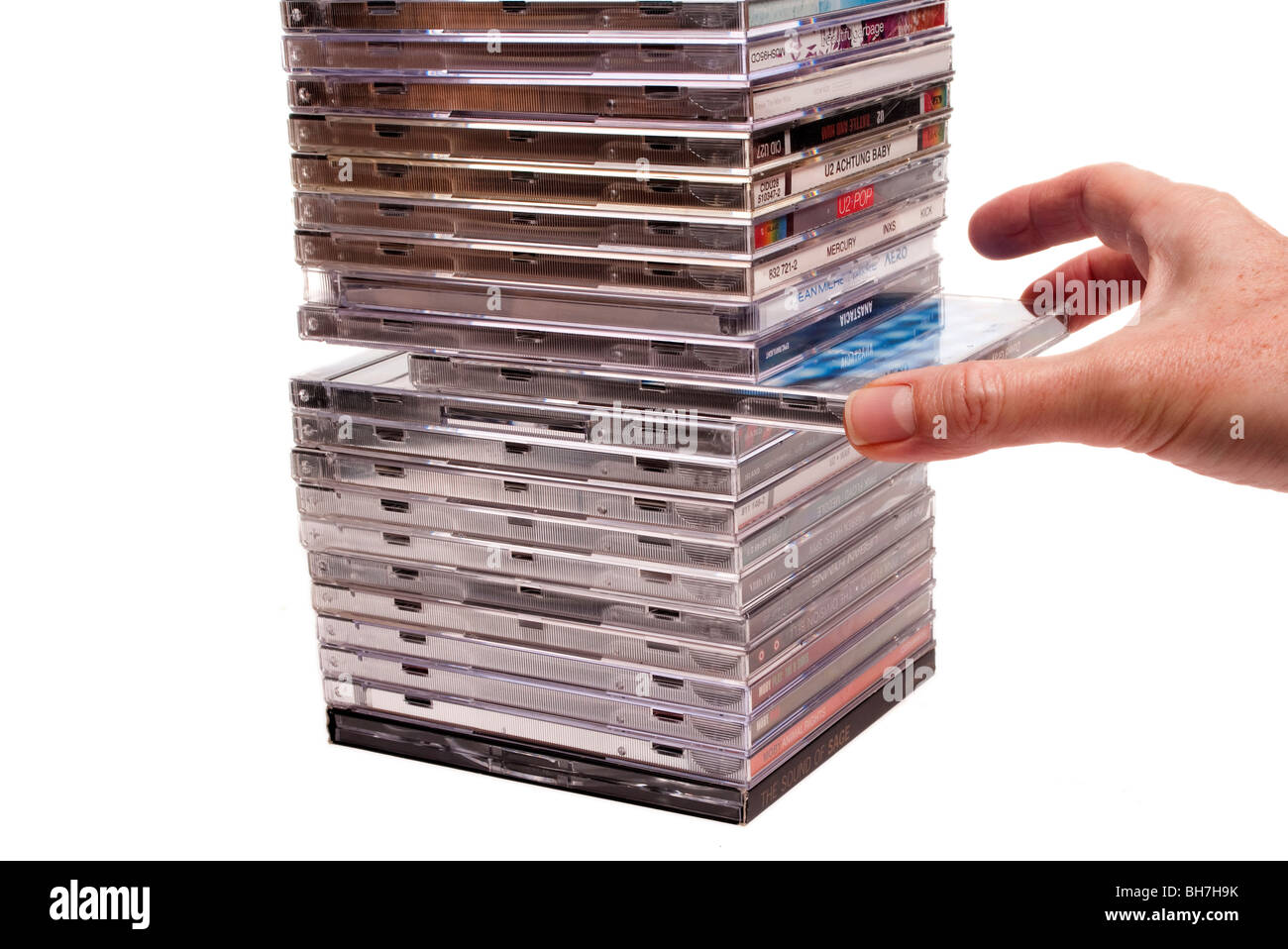 taking cd from stack of cds Stock Photo